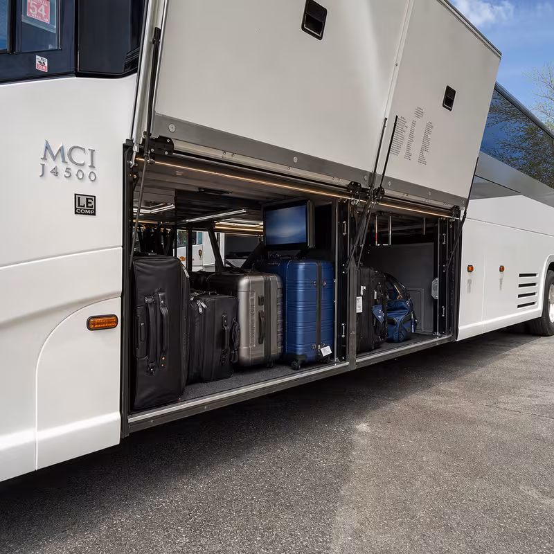 Party bus interior with wraparound leather seating and LED lighting in Toledo