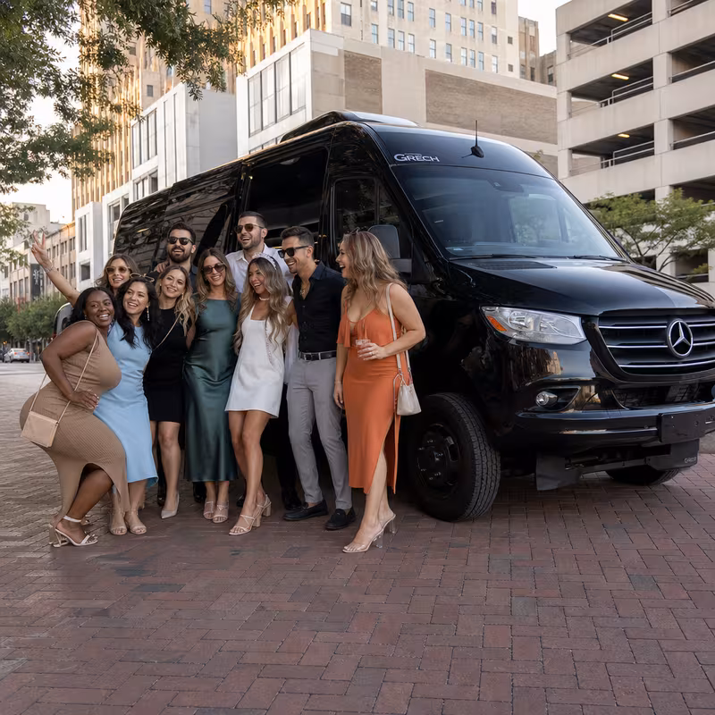 Group boarding a white charter bus for Bachelor & Bachelorette Transportation transportation in Toledo