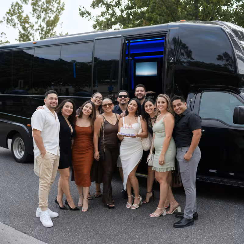 Party bus interior with wraparound leather seating and LED lighting in Toledo