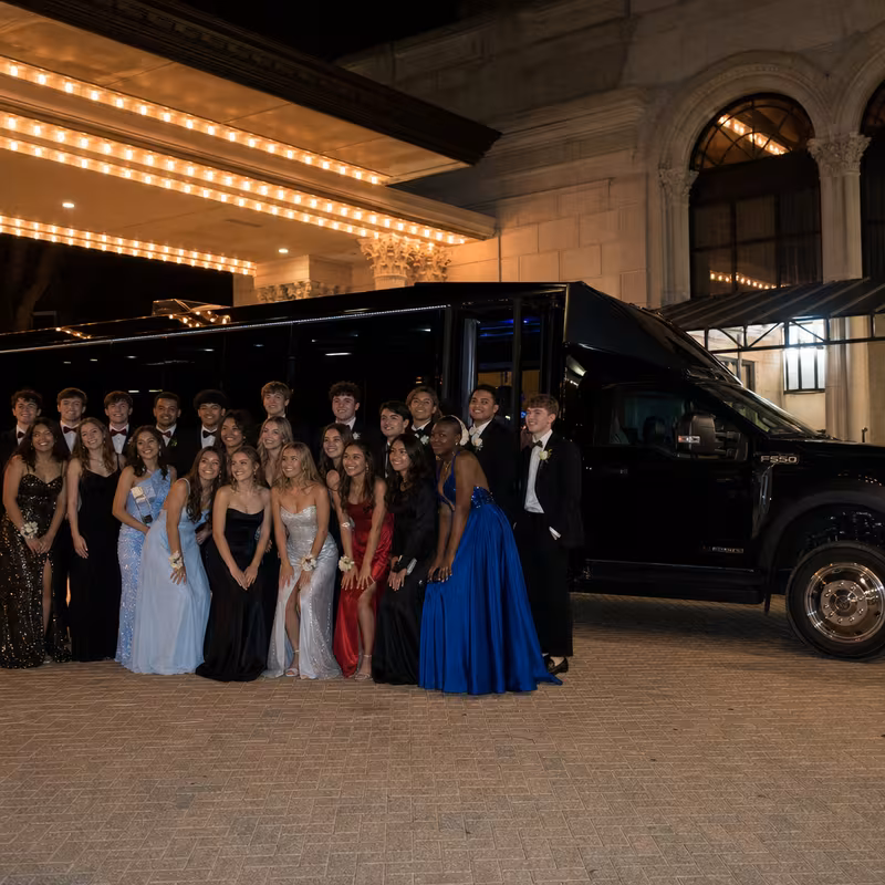 Party bus interior with wraparound leather seating and LED lighting in Toledo