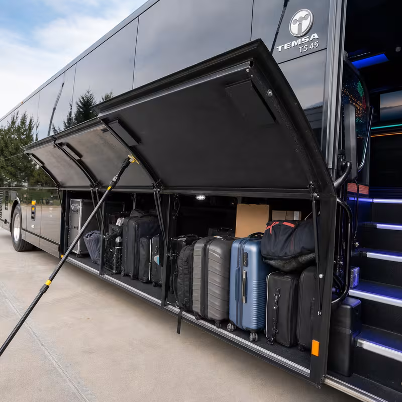 Party bus interior with wraparound leather seating and LED lighting in Toledo