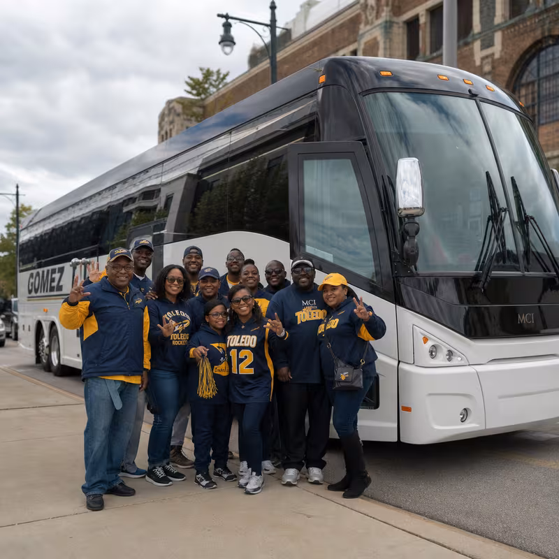 Passengers loading luggage while boarding an Toledo group shuttle