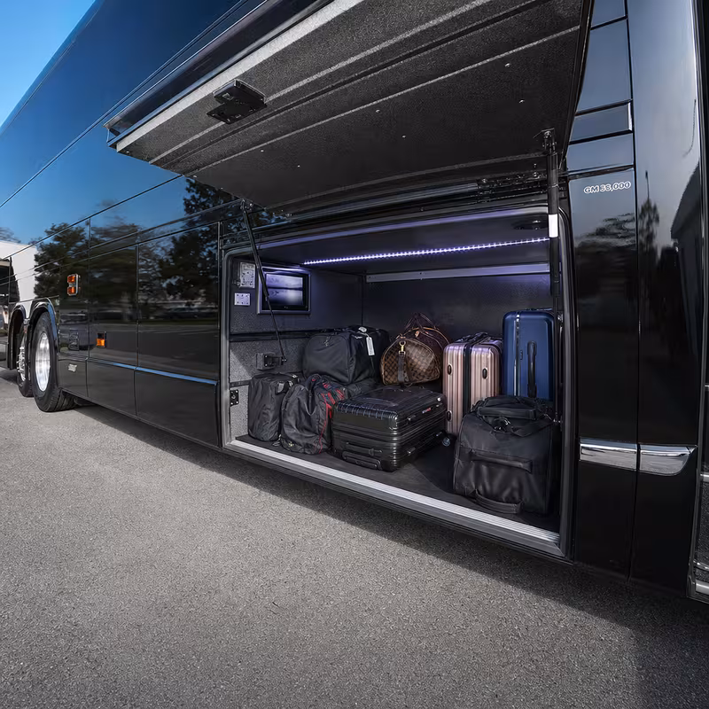 Party bus interior with wraparound leather seating and LED lighting in Toledo